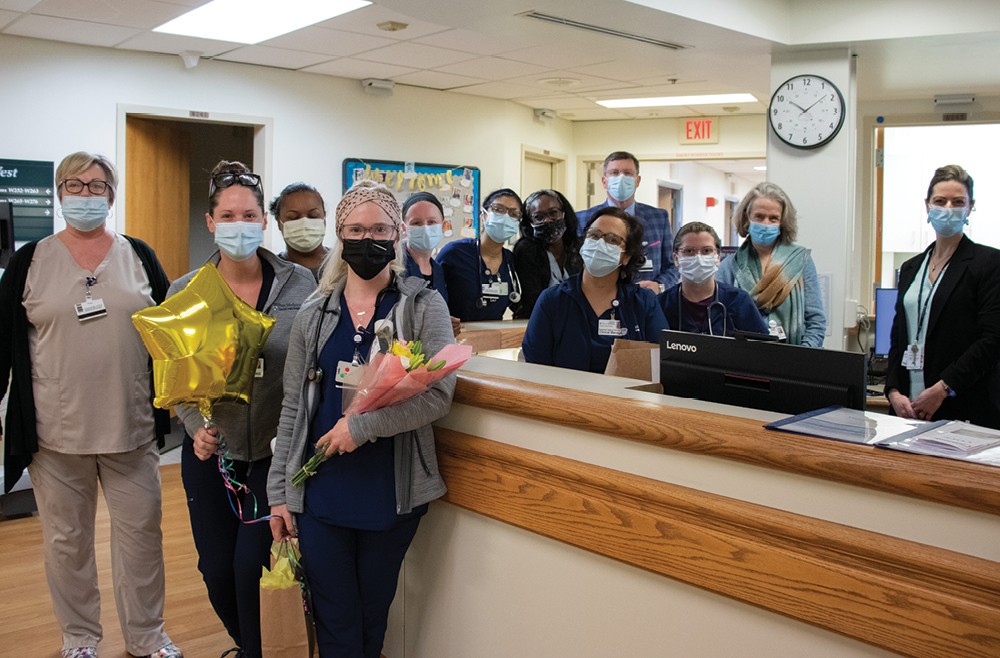 Abigail Jewell, RN, BSN, center, and the nurses of 2-West presented Abigail with flowers, balloons, a small gift and kind words from her colleagues.